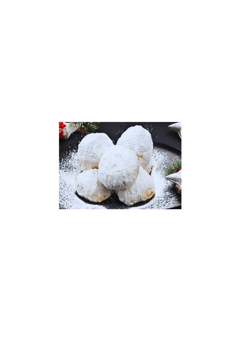 Traditionelles griechisches Weihnachtsgebäck-Kourambiedes mit Zitronenöl auf einem Teller