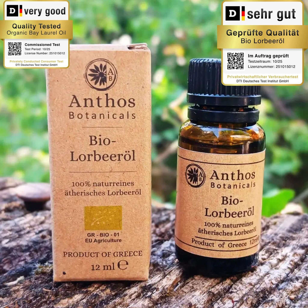 Ein braunes Glasfläschen mit Lorbeeröl & brauner Verpackung auf einem Felsen in der Natur.