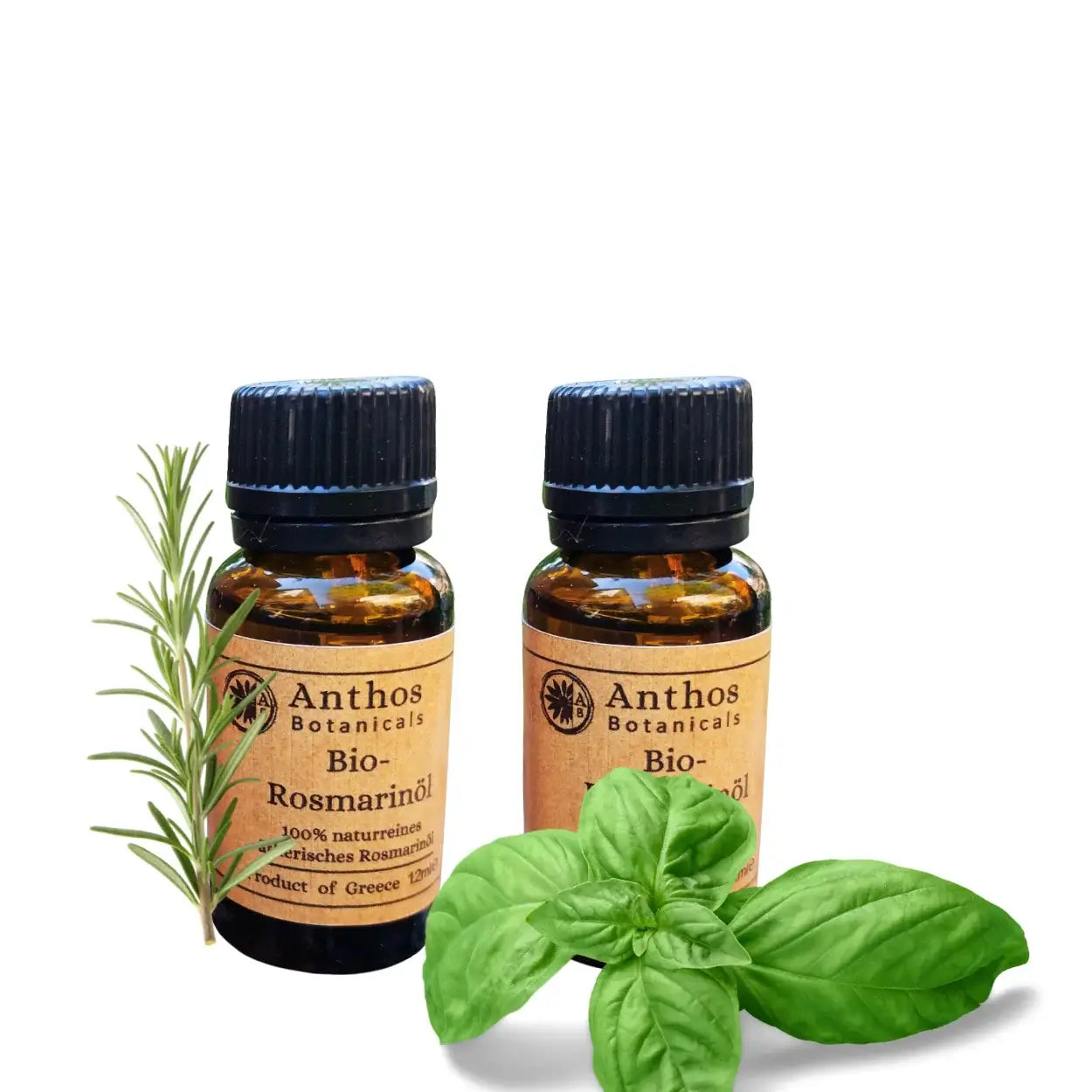 Zwei Braunglasflaschen mit ätherischem Rosmarin- und Basilikumöl.