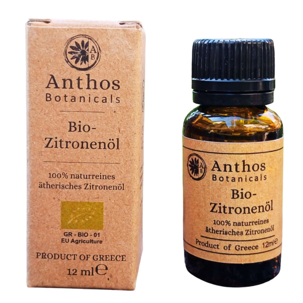 Verpackung und Braunglasflasche mit ätherischem Zitronenöl bio von Anthos Botanicals.