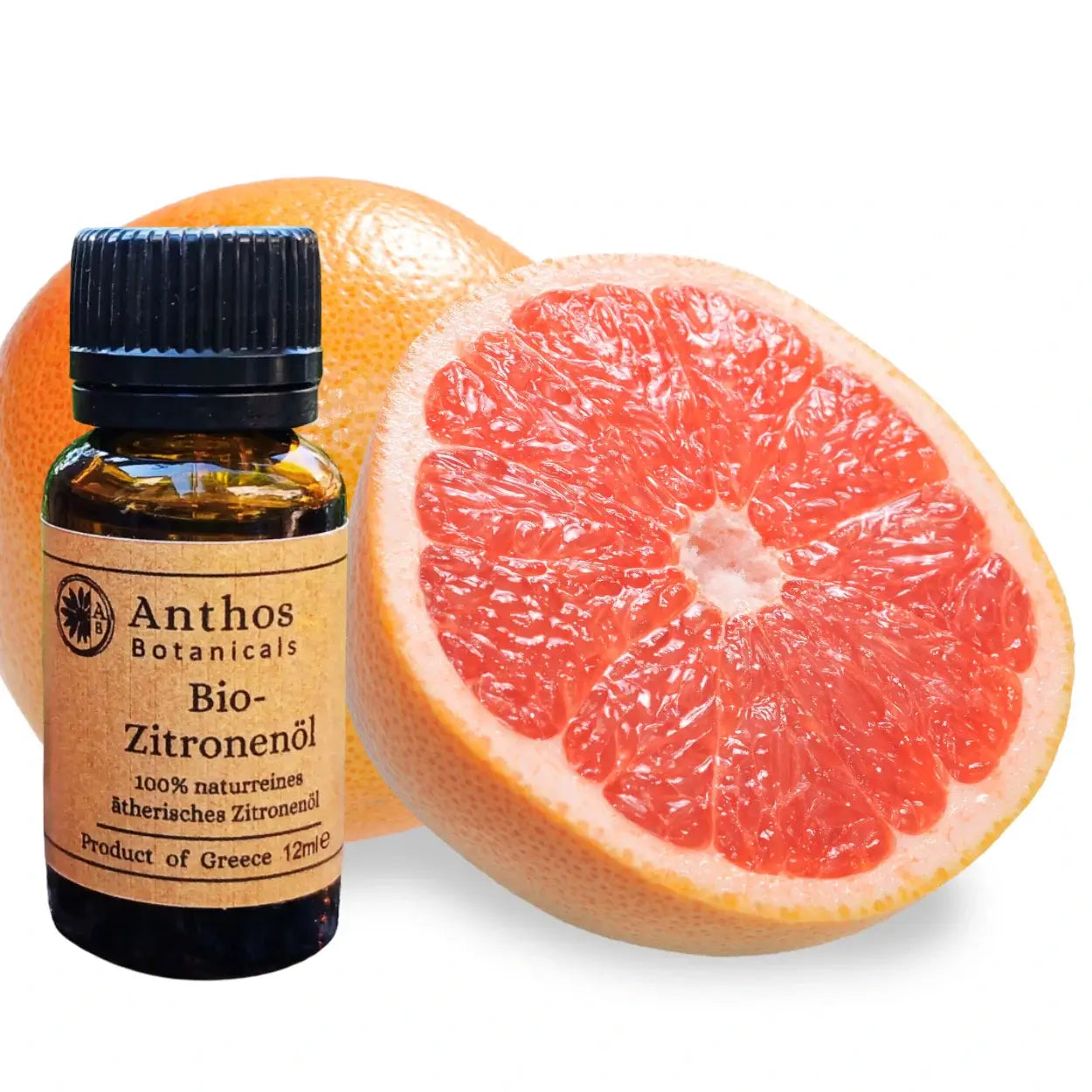 Ätherisches Zitronenöl bio und eine aufgeschnittene Grapefruit.